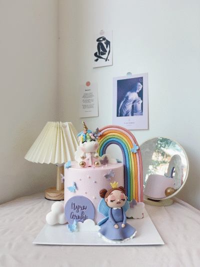 Nyra Aruhi's Baby Girl with Unicorn and Rainbow Cake