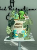 Adam Shafiy's Little Boy on Dinosaur Cake