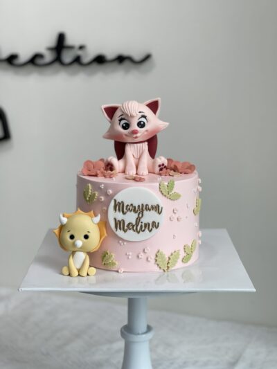 Maryam Medina's Pink Cat and Yellow Dinosaur Cake